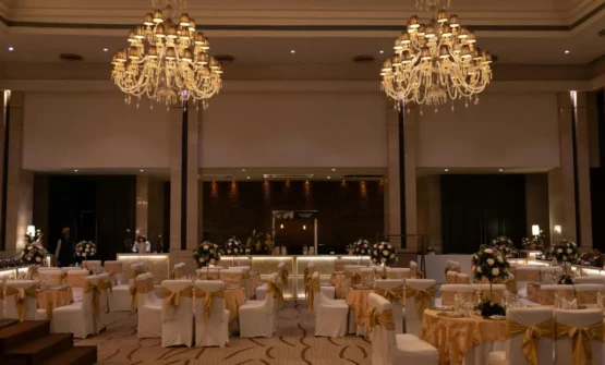 Elegant event space with banquet tables and chandeliers for weddings and private events in Singapore
