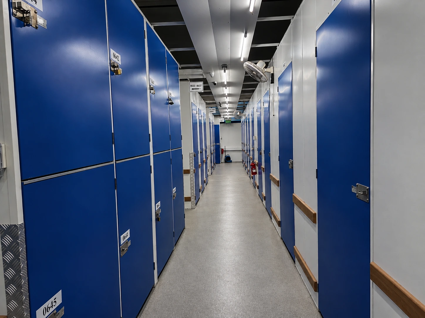 Non-air-conditioned self-storage corridor with individual storage units at EBC Lifestyle Hub Singapore.