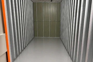 Clean and empty jumbo self-storage unit with spacious metal interior at EBC Lifestyle Hub Singapore.