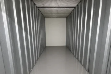 Clean and empty large self-storage unit with metal interior at EBC Lifestyle Hub Singapore.