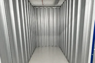 Clean and empty medium self-storage unit with metal interior at EBC Lifestyle Hub Singapore.